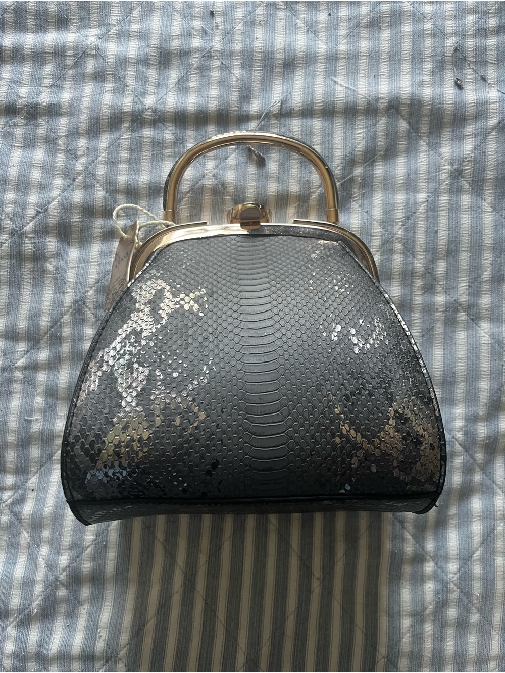 Alyssa black and silver snakeskin print purse with gold accents